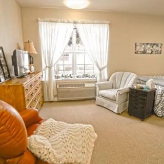 A cozy living room with comfortable seating and warm decor.