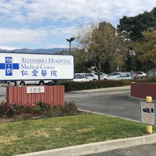 Exterior view of a medical center with a clear sign indicating its services.