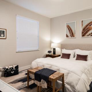 A modern bedroom with stylish decor and cozy ambiance.