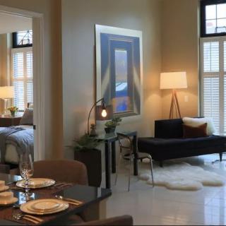A modern living room with elegant furniture, art, and a cozy ambiance.