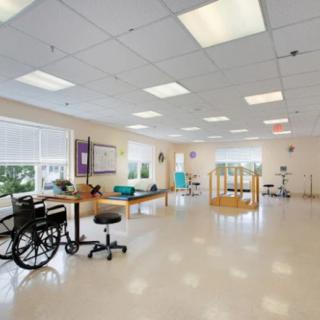 A well-equipped rehabilitation center with exercise equipment and therapy spaces.