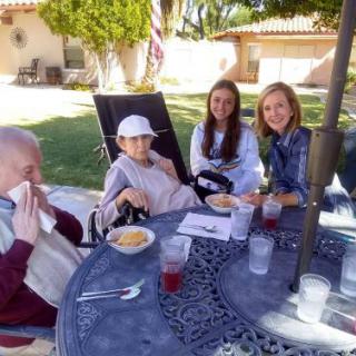 Family enjoying a sunny day outdoors.