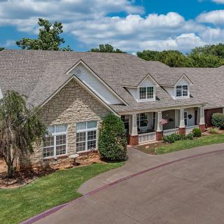 A spacious residential home with a well-maintained front yard and driveway.
