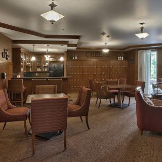 A cozy lounge area with comfortable seating and warm lighting.