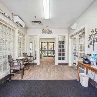 A bright and inviting lobby area with seating and tables.