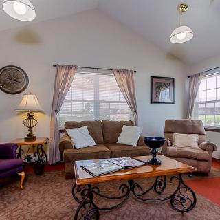 A cozy living room with comfortable seating and warm decor.