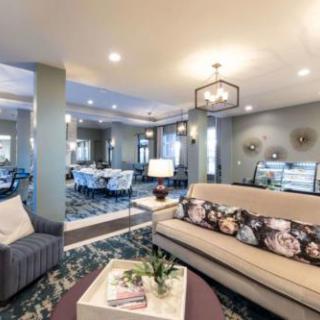 A spacious and modern living room with elegant decor and comfortable seating.