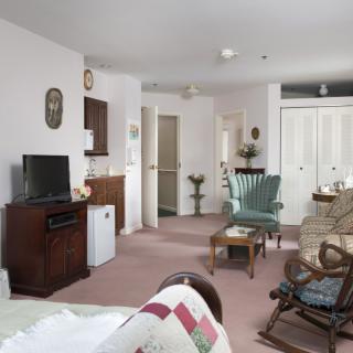 A cozy living room with comfortable seating and a television.