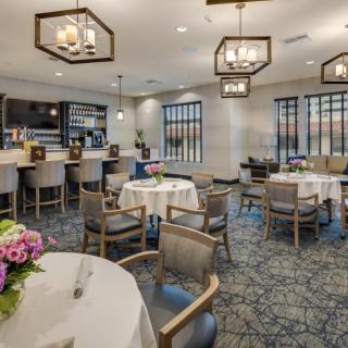 A stylish restaurant interior with elegant seating arrangements and ambient lighting.