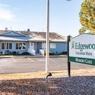 Exterior view of a building with a sign for Edgewood Memory Care.