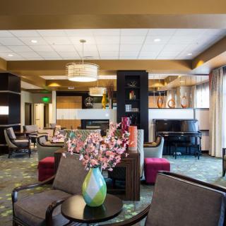 A modern hotel lobby with stylish furniture and decor.