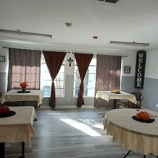 A cozy dining area with welcoming decor and neatly arranged tables.