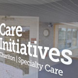 Signage for Care Initiatives, indicating their focus on specialty and charitable care.