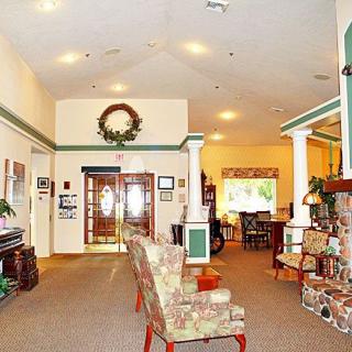 A cozy lobby area with seating and decorative elements.
