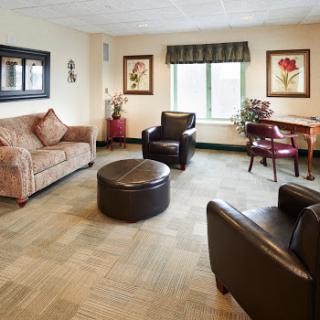A cozy living room setup with comfortable seating and decorative elements.