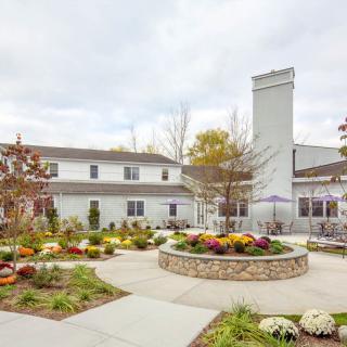 A beautifully landscaped garden in front of a modern building.