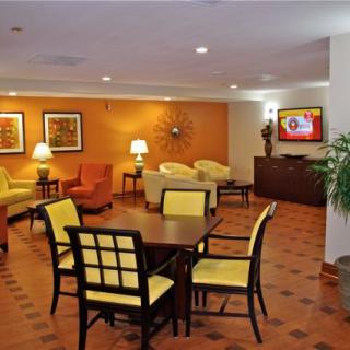A cozy lobby area with comfortable seating and warm lighting.