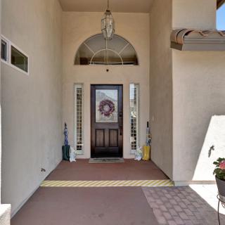 A welcoming front entrance with a decorative wreath on the door.