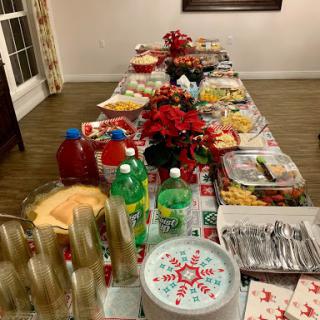A festive table filled with a variety of snacks and drinks, perfect for a holiday gathering.