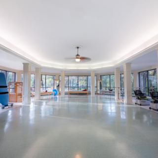 Spacious and modern fitness center with various exercise equipment.
