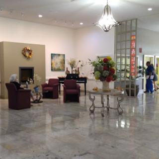A cozy and inviting lobby area featuring comfortable seating and decorative elements.