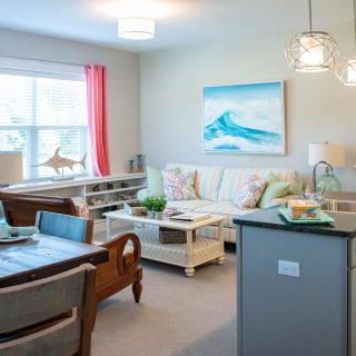 A modern living room with bright accents and an open layout.