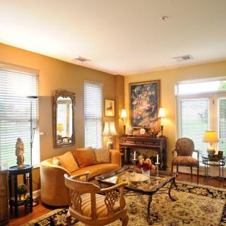 A cozy living room with elegant furniture and warm lighting.