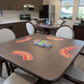 A kitchen area with a table set up for a card game.