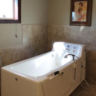 A modern bathtub in a serene bathroom setting.