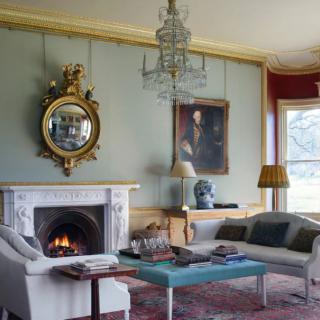 A classic living room with a fireplace and elegant decor.