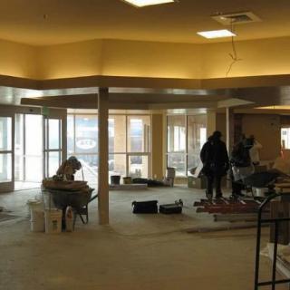 Construction workers engaged in interior renovation.