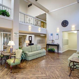 A spacious and elegantly decorated lobby area with comfortable seating and ambient lighting.