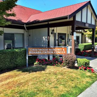 The exterior of a Christian Adventist church with a welcoming sign and well-maintained garden.