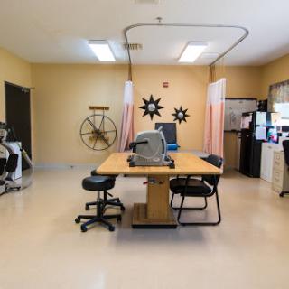 A well-lit office space equipped for medical or therapeutic services.