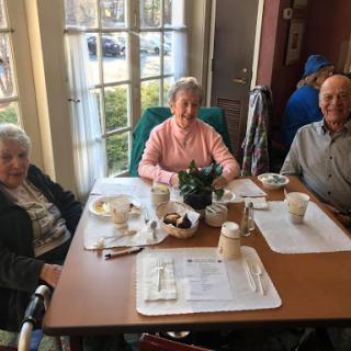 A warm gathering of friends enjoying a meal together.