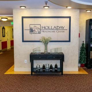 A welcoming lobby area with 'Holladay Properties' signage and decorative accents.
