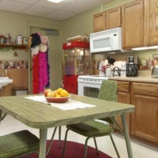 A vintage-style kitchen with retro appliances and decor.