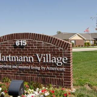 Entrance sign for Hartmann Village, a retirement and assisted living facility.