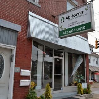 A storefront displaying a business named 'At Home' with clear signage.