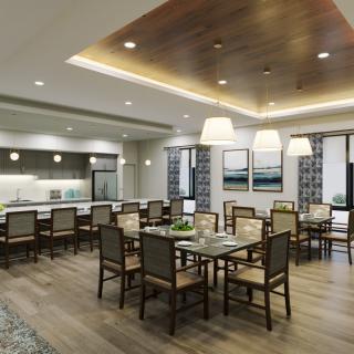 A modern dining room with elegant furnishings and ceiling lighting.