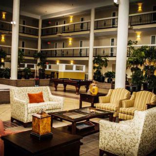 A stylish hotel lobby with comfortable seating arrangements and elegant decor.