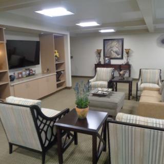 A cozy living room with comfortable seating and a television.