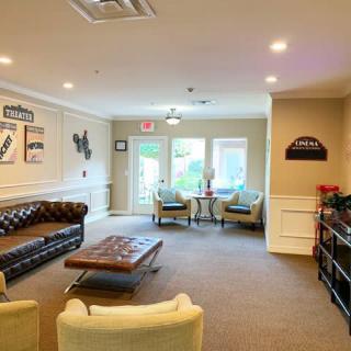 A cozy living room with comfortable seating and elegant decor.