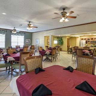 An inviting restaurant dining area with neatly arranged tables and chairs.