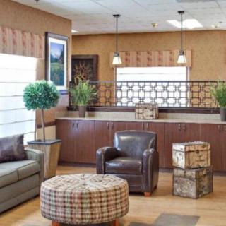 A modern waiting room with comfortable seating and stylish decor.