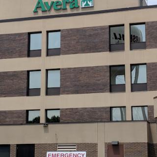 Avera hospital building with an emergency sign visible at the entrance.