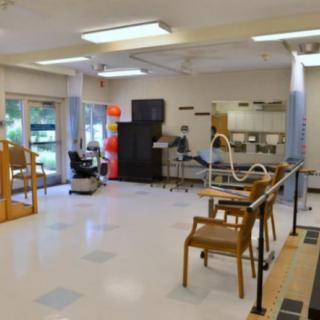 A physical therapy room equipped with various rehabilitation tools and exercise equipment.