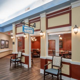 A cozy indoor seating area with classic architectural details and wall art.