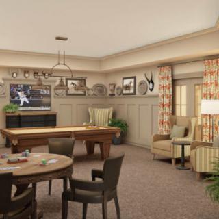 A cozy living room with a pool table, television, and comfortable seating.
