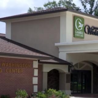 A modern commercial building with signage indicating a business center.